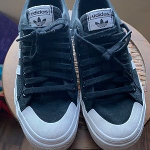 Adidas Nizza black with white stripes decent condition size women's size 8